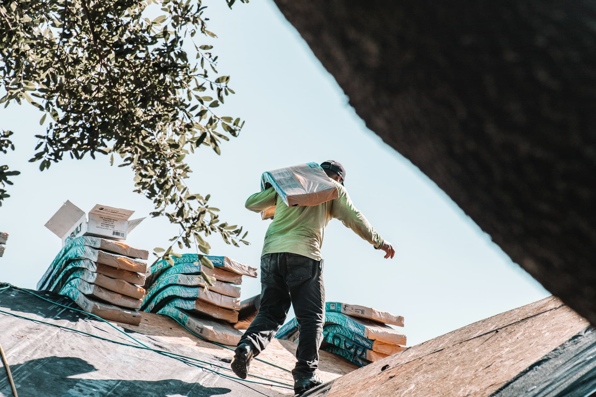 Roofer Carrying Shingles